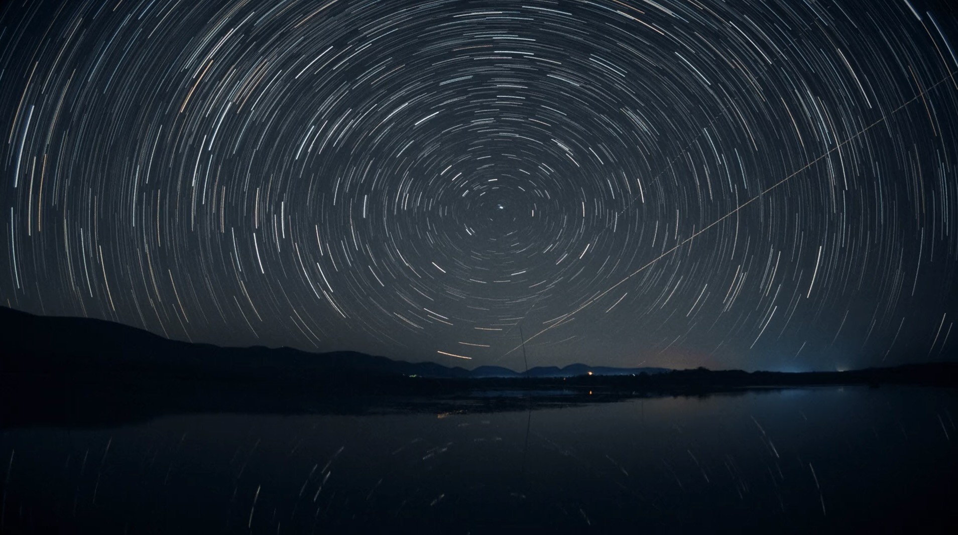 image of a dark sky with turning stars.jpg